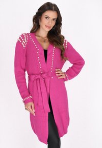 Длинный жилет