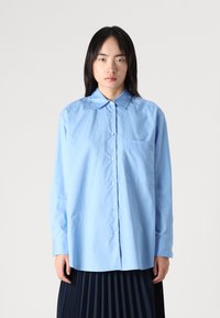 Длинная блузка