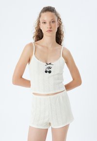 Топ на бретельках