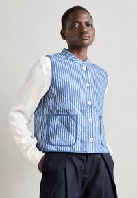 Джинсовая жилетка