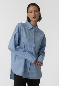 Длинная блузка