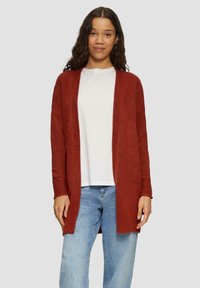 Длинный жилет