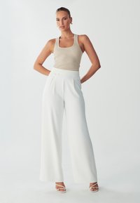 Широкие брюки Широкие брюки