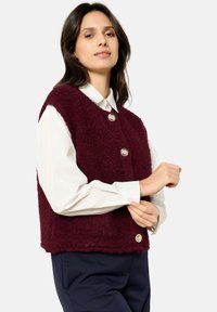 Джинсовая жилетка