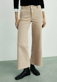 Клешеные джинсы Клешеные джинсы