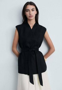 Длинный жилет Длинный жилет