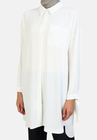 Длинная блузка