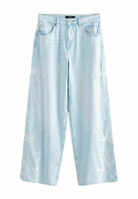 Клешеные джинсы