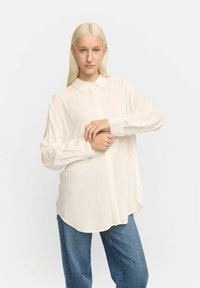 Длинная блузка