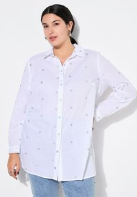 Длинная блузка