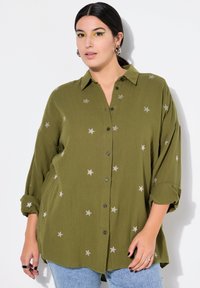 Длинная блузка