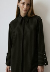 Длинная блузка