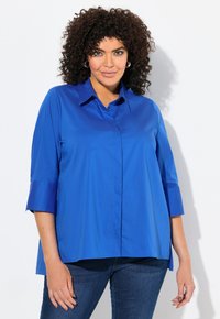 Длинная блузка