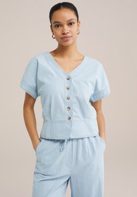 Джинсовая жилетка