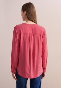 Длинная блузка