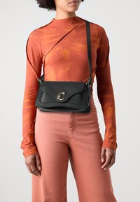 Кожаная сумка