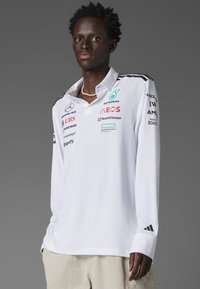 Поло с длинным рукавом