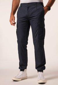 Брюки с накладными карманами Брюки с накладными карманами