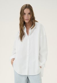 Длинная блузка