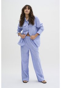 Длинная блузка