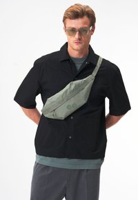 Сумка на пояс Сумка на пояс