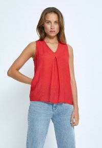 Блузка без рукавов