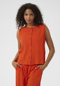 Блузка без рукавов