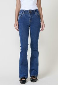 Клешеные брюки