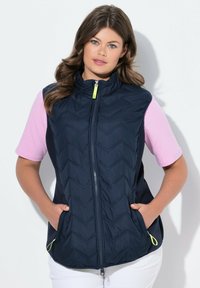 Стеганый жилет