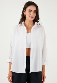 Длинная блузка