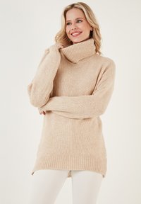 Длинный пуловер