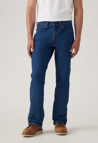 Клешеные джинсы