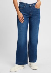 Клешеные джинсы Клешеные джинсы