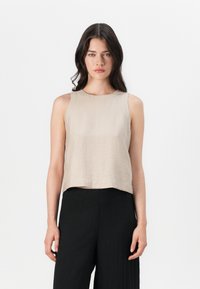 Блузка без рукавов