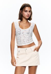 Юбка с накладными карманами