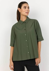 Длинная блузка