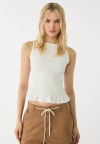 Блузка без рукавов