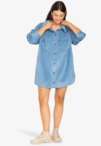 Длинная блузка