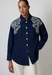 Джинсовая блузка