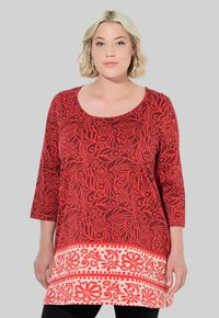 Длинная блузка