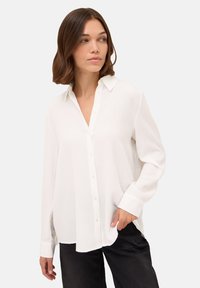 Длинная блузка