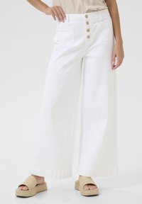 Клешеные джинсы