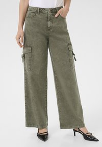 Клешеные джинсы