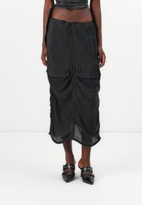 Юбка с накладными карманами