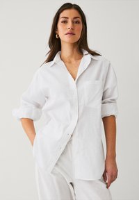 Длинная блузка