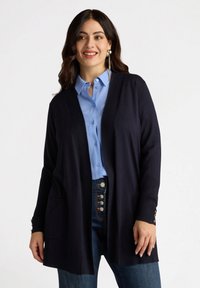 Длинный жилет