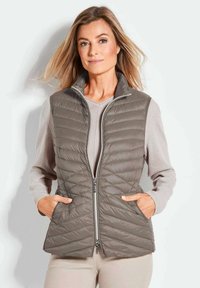 Стеганый жилет