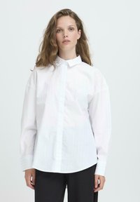 Длинная блузка