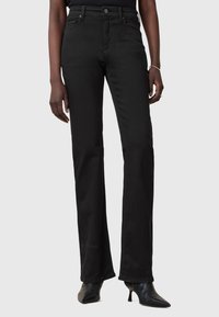 Клешеные брюки