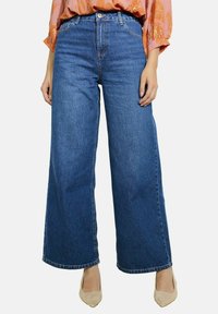 Клешеные джинсы Клешеные джинсы